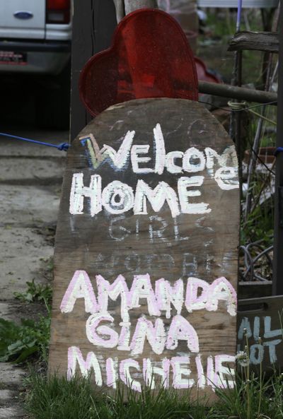 A sign rests in front of a home Saturday in Cleveland. (Associated Press)
