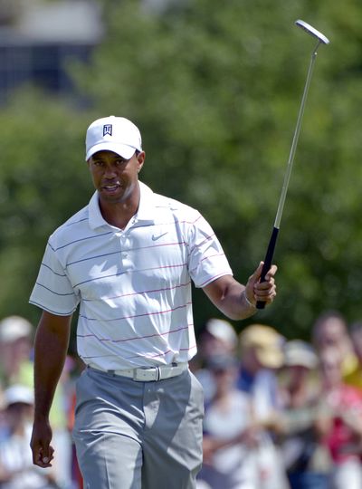 Tiger Woods shares the lead with Charlie Wi after two rounds. (Associated Press)