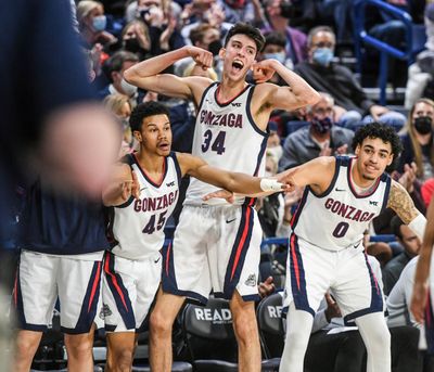 Gonzaga players Rasir Bolton, Chet Holmgren and Julian Strawther celebrate a Drew Timme basket against Pacific on Feb. 10 in the McCarthey Athletic Center.  (Dan Pelle/The Spokesman-Review)