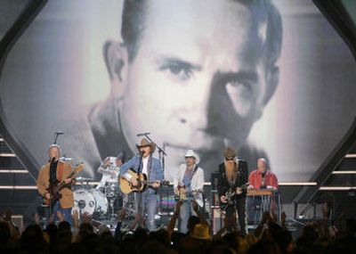 
Chris Hillman, from left, Travis Barker, Dwight Yoakam, Brad Paisley, Billy Gibbons and Buddy Alan Owens perform a medley in tribute to Buck Owens at the 41st Academy of Country Music Awards.
 (Associated Press / The Spokesman-Review)