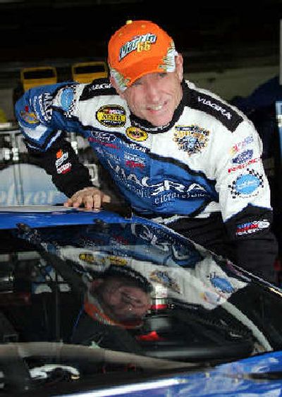 
Mark Martin enters his car in the garage before the start of a practice session at Michigan International Speedway. 
 (Associated Press / The Spokesman-Review)