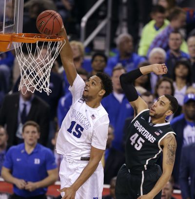 Not only does Jahlil Okafor rattle the rim with his dunks, but his defense has been improving during Duke’s run to the title game. (Associated Press)