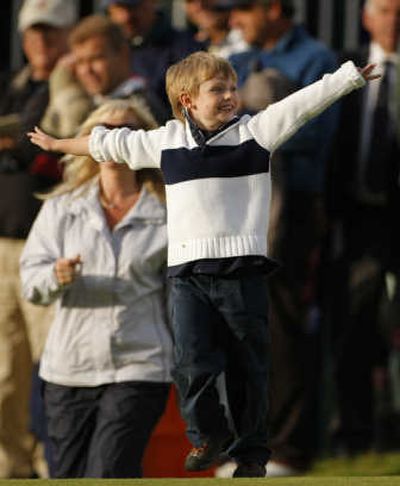 
Padraig Harrington's son, Patrick, runs onto the 18th green after his father won the British Open.Associated Press
 (Associated Press / The Spokesman-Review)