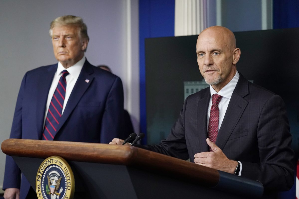 President Donald Trump listens as Dr. Stephen Hahn, commissioner of the U.S. Food and Drug Administration, speaks during a media briefing in the James Brady Briefing Room of the White House, Sunday, Aug. 23, 2020, in Washington. (Alex Brandon)