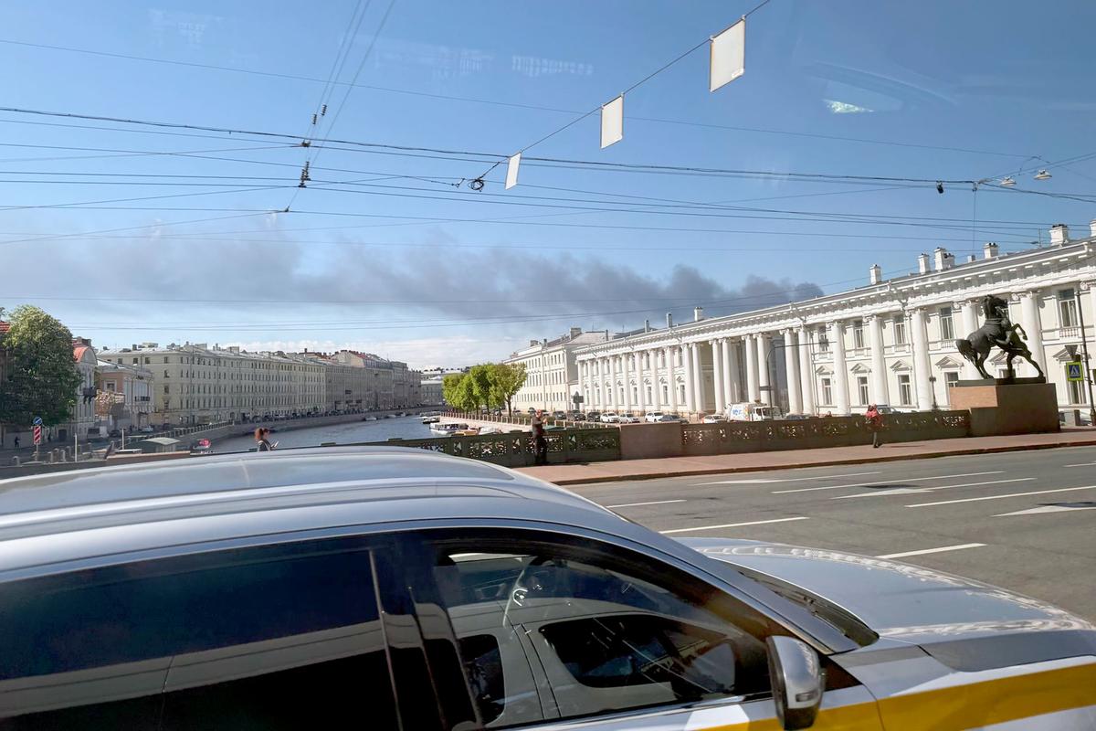 Thick black smoke and flames rise over the St Petersburg Oil Terminal, following a massive overnight Ukrainian drone attack.  (Ulf Mauder/dpa/TNS)
