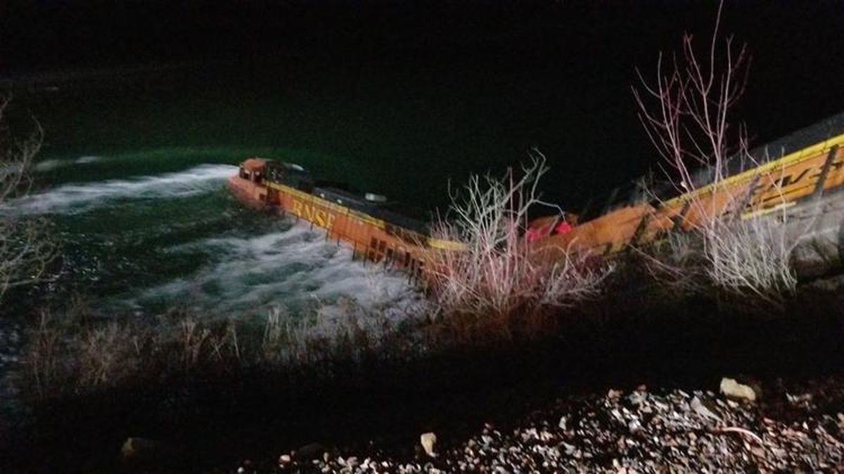 Emergency crews have rescued two train operators trapped in a BNSF engine that derailed into the Kootenai River 10 miles east of Bonners Ferry on Wednesday, Jan. 1, 2020. (Courtesy of Idaho State Police)