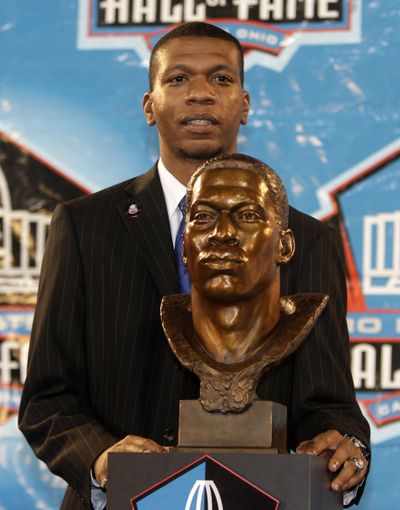 Bob Hayes Jr., son of Bob Hayes, stands with the bust of his father in Canton, Ohio.  (Associated Press / The Spokesman-Review)