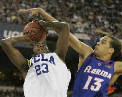 
Joakim Noah, blocking Luc Richard Mbah a Moute's shot, was selected the outstanding player of the Final Four. 
 (Associated Press / The Spokesman-Review)