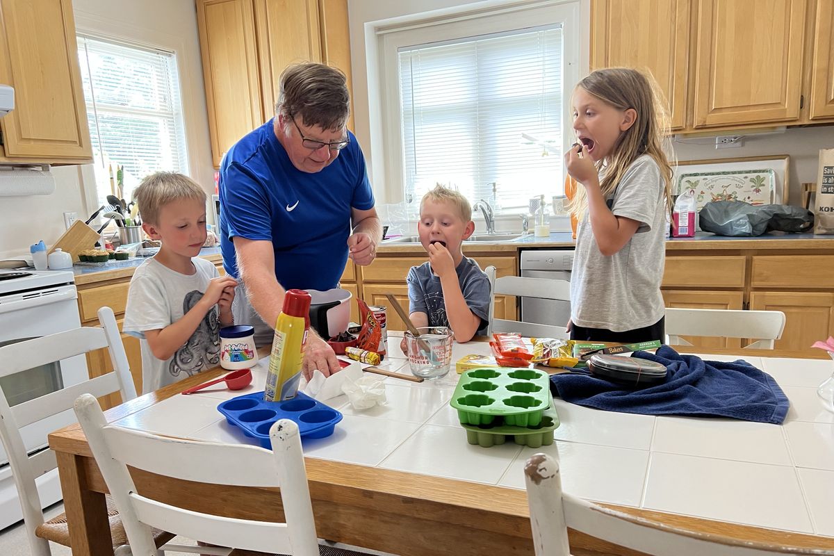 Marc Connally, aka “Uncle Fudge,” mixes up a batch of candy with a young nephew and his friends in Tacoma. (Photo courtesy of Debbie Connally)