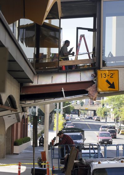 A piece of the skywalk over Howard Street was damaged Thursday. (Dan Pelle / The Spokesman-Review)
