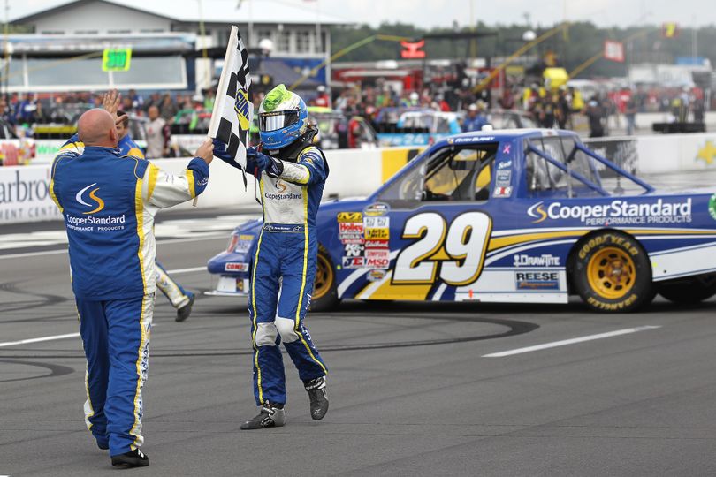 Ryan Blaney, driver of the #29 Cooper Standard Ford, celebrates with his crew after winning the NASCAR Camping World Truck Series Pocono Mountains 125 at Pocono Raceway on August 3, 2013 in Long Pond, Pennsylvania. (Photo by Todd Warshaw/NASCAR via Getty Images) (Todd Warshaw / Nascar)