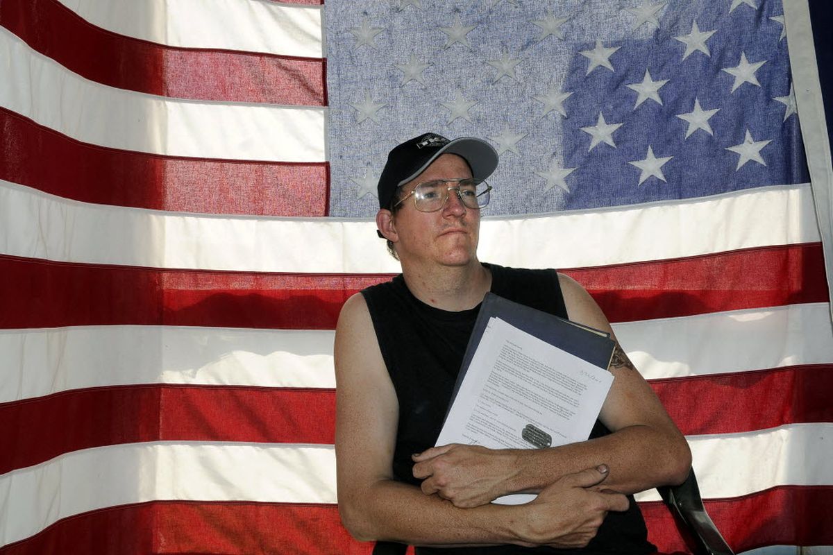 Tony McGrath of Spokane Valley holds his father