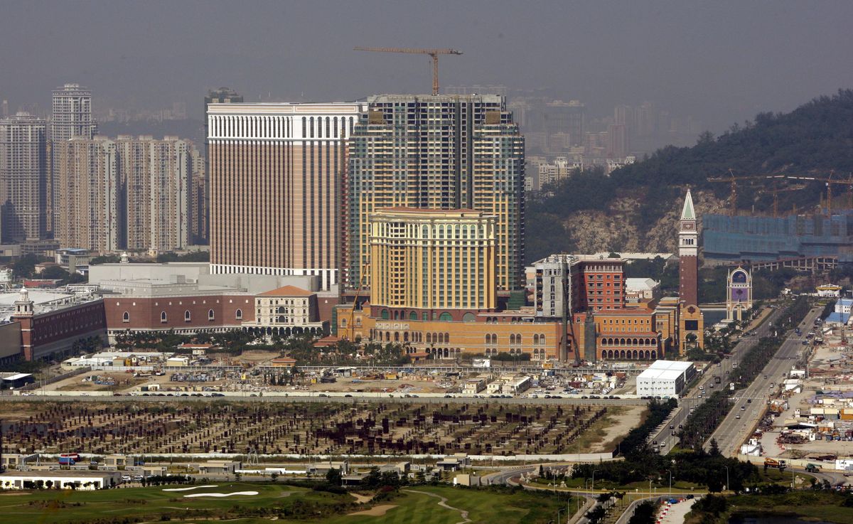 A construction crane stands idle atop the hulking steel shells of three half-finished hotel towers of Las Vegas Sands Corp. project on the Cotai strip in Macau on the day the troubled casino giant suspended work on the mega resorts amid a cash crunch. Global economic and financial woes are delaying new projects. Associated Press file photos (Associated Press file photos / The Spokesman-Review)