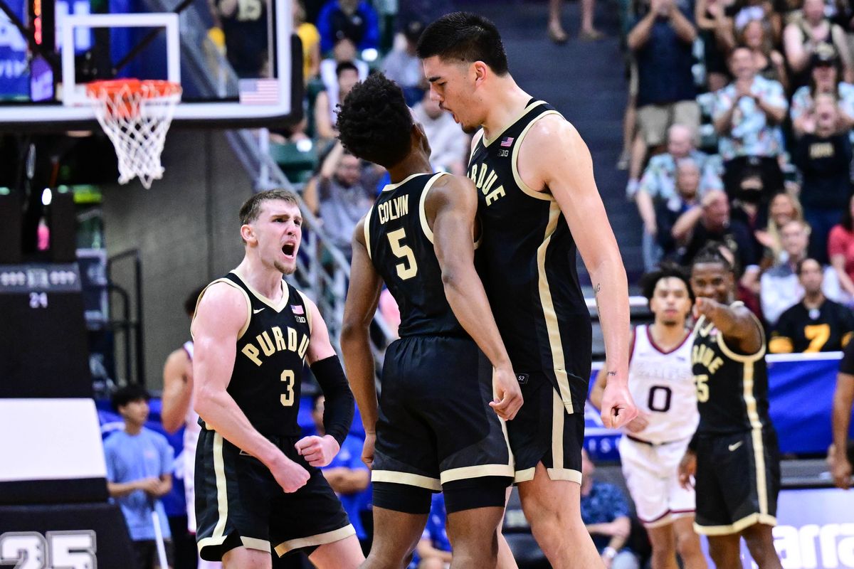 Purdue Boilermakers center Zach Edey, right, chest-bumps guard Myles Colvin while guard Braden Smith cheers after Colvin hit a 3 against Gonzaga on Monday.  (Tyler Tjomsland/The Spokesman-Review)