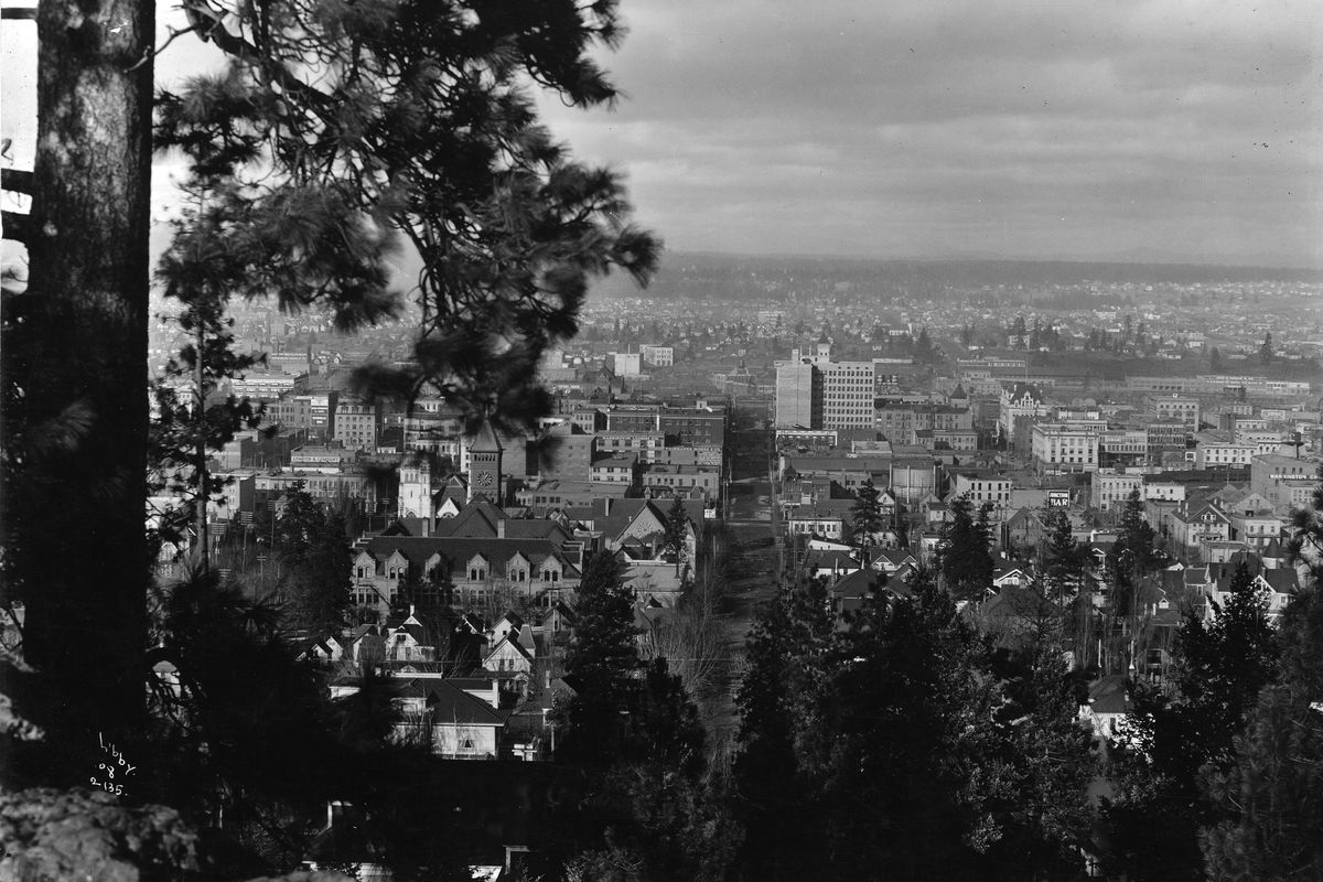 1908: This view of downtown Spokane is looking north down Stevens from Cliff Drive. The August Paulsen Building stands tall in the center of the photo.