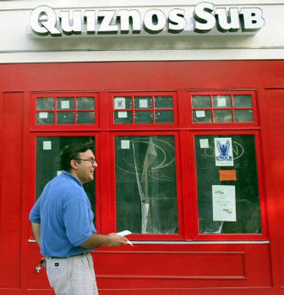 
Zahoor Badshah at the Quiznos Sub franchise he is opening in Milford, Conn., just down the street from the Subway world headquarters. 
 (Associated Press / The Spokesman-Review)