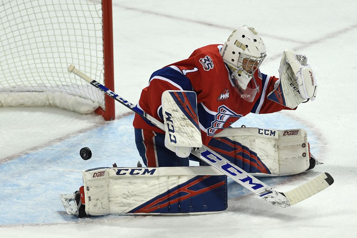 Prince George Cougars forward Josh Maser (11) scores against Spokane Chiefs goalie Campbell Arnold (1) during the first period of a WHL hockey game, Fri., Oct. 11, 2019, in the Spokane Arena. (Colin Mulvany / The Spokesman-Review)