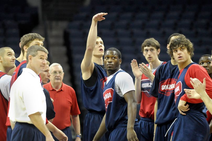 Gonzaga coaches and players turn to watch as Micah Downs (rear with hand up ) shoots fom half court in Memphis, Tenn. Thursday March 26, 2009 as they prepare for their Sweet Sixteen game against North Carolina Friday.    CHRISTOPHER ANDERSON The Spokesman-Review (Christopher Anderson / The Spokesman-Review)