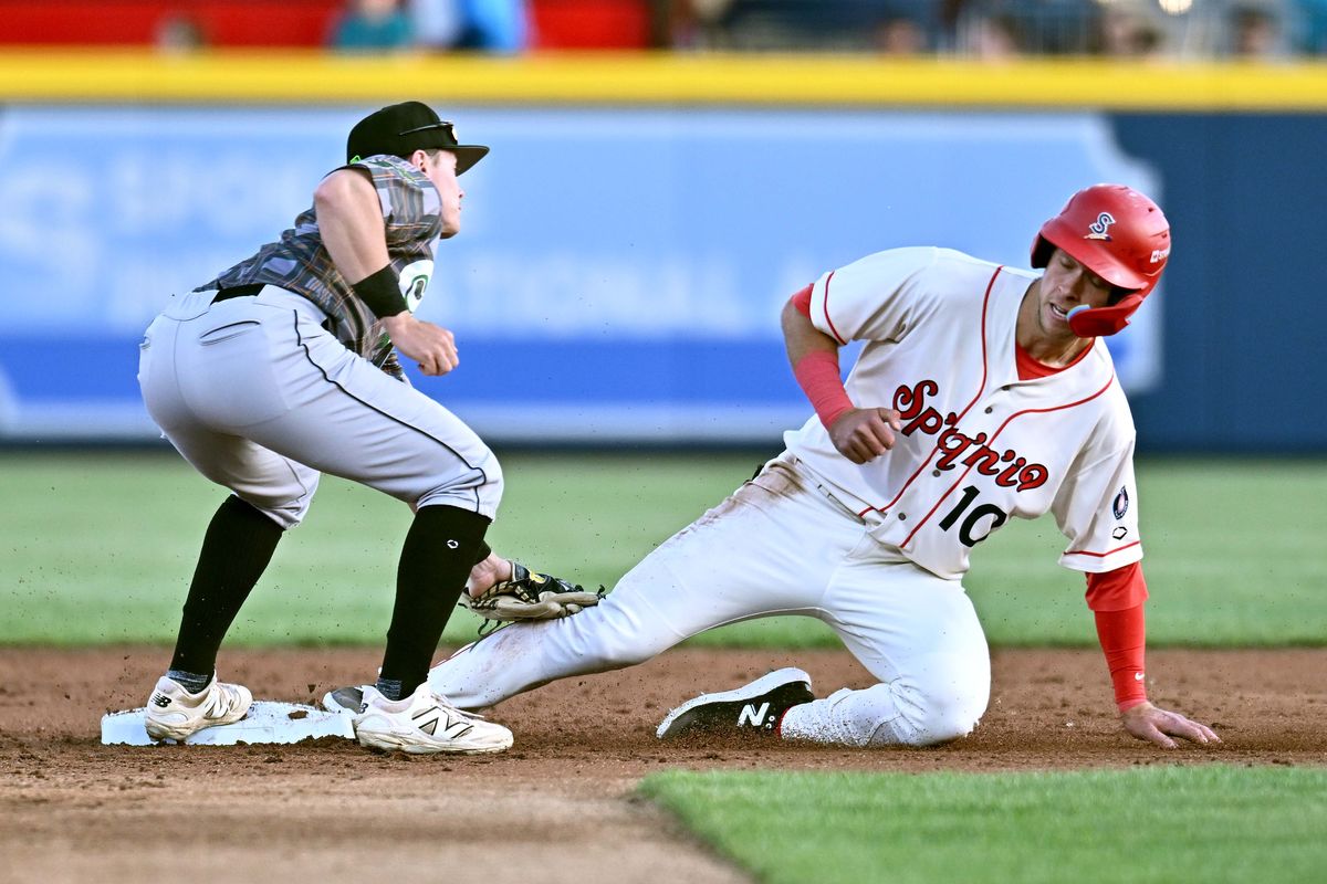 Spokane Indians third base Skyler Messinger is tagged out at second by Eugene Emeralds shortstop Cole Foster on April 24, 2025 at Avista Stadium.  (James Snook/Spokane Indians)