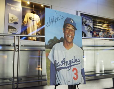 A portrait of baseball great Willie Davis is seen at a memorial service for him at Dodger Stadium.  (Associated Press)