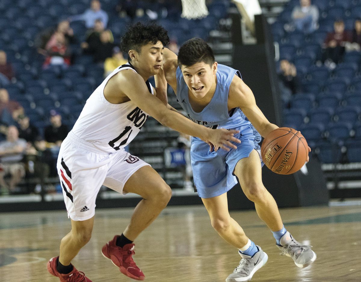 Central Valley’s Dylan Darling, right, is fouled by Union’s Izaiah Vongnath during a 2020 State 4A semifinal.  (Patrick Hagerty/For The Spokesman-Review)