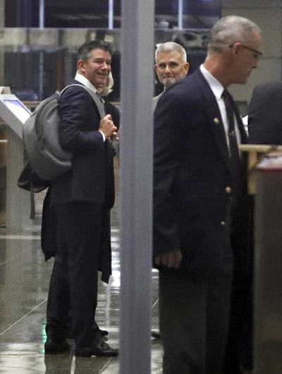 Former Uber CEO Travis Kalanick, left, goes through a security line upon entering a federal courthouse on Wednesday, Feb. 7, 2018, in San Francisco. Kalanick took the witness stand Wednesday for a second day, offering his initial response to allegations that he cooked up a scheme to steal self-driving car technology from Google. (Ben Margot / Associated Press)