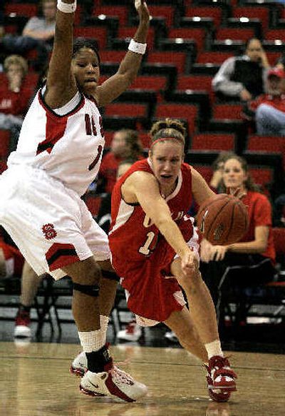 Utah's Shona Thorburn, right, drives past N.C. State's Khadijah Whittington.
(Associated Press / The Spokesman-Review)