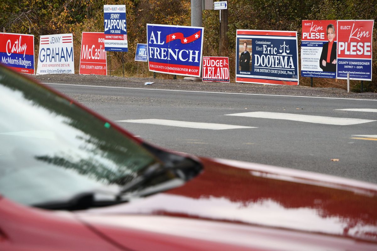 Candidate yard signs sit by the road in October along Government Way near Spokane Falls Community College.  (Colin Tiernan/The Spokesman-Review)