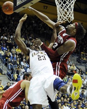 DeAngelo Casto makes sure Cal’s Patrick Christopher doesn’t get to the basket. (Associated Press)