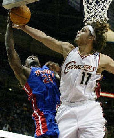 
Cleveland Cavaliers forward Anderson Varejao blocks the shot of Detroit Pistons forward Antonio McDyess in the second quarter Tuesday night. 
 (Associated Press / The Spokesman-Review)