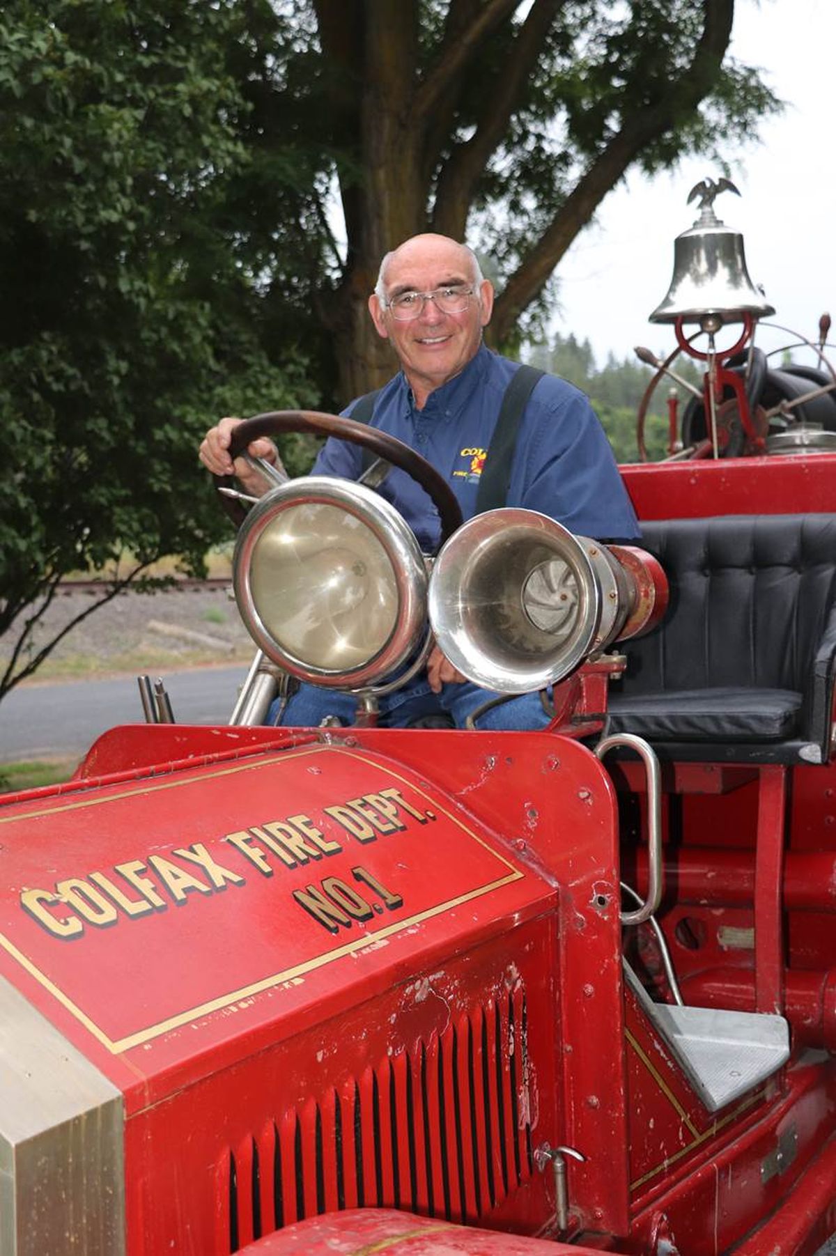 Former Colfax Fire Chief Jim Krouse is seen riding a historic fire truck in this undated photo from the Colfax Fire Department. Krouse, 76, died Saturday while responding to a wildfire.  (Courtesy Colfax Fire Department)