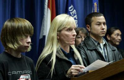 
Family members of murdered Bobbie Jo Stinnett, from left, brother Tyler Harper, mother Becky Harper, and husband Zeb Stinnett, speak to the press Friday after jurors in the trial of Lisa Montgomery, Bobbie Jo Stinnett's killer,  recommended the death sentence. Associated Press
 (Associated Press / The Spokesman-Review)