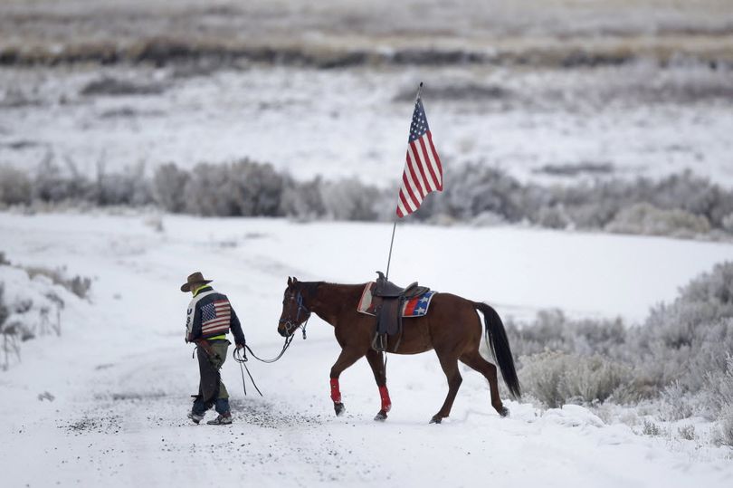 Cowboy Duane Leo Ehmer, 45, of Irrigon, Ore., a supporter of the group occupying the Malheur National Wildlife Refuge, walks his horse near Burns, Ore., on Jan. 7. Ehmer and two other occupiers were arrested Wednesday. (AP File Photo/Rick Bowmer) 