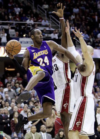
Kobe Bryant, left, is pressured by Cleveland's LeBron James, center.Associated Press
 (Associated Press / The Spokesman-Review)