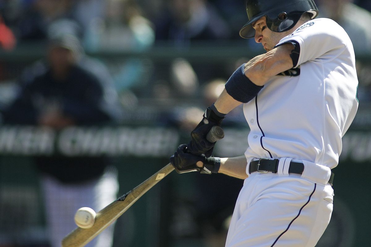 Seattle’s Brendan Ryan connects on a two-home run in the second inning of the Mariners’ win over the Athletics at Safeco Field on Sunday. (Associated Press)