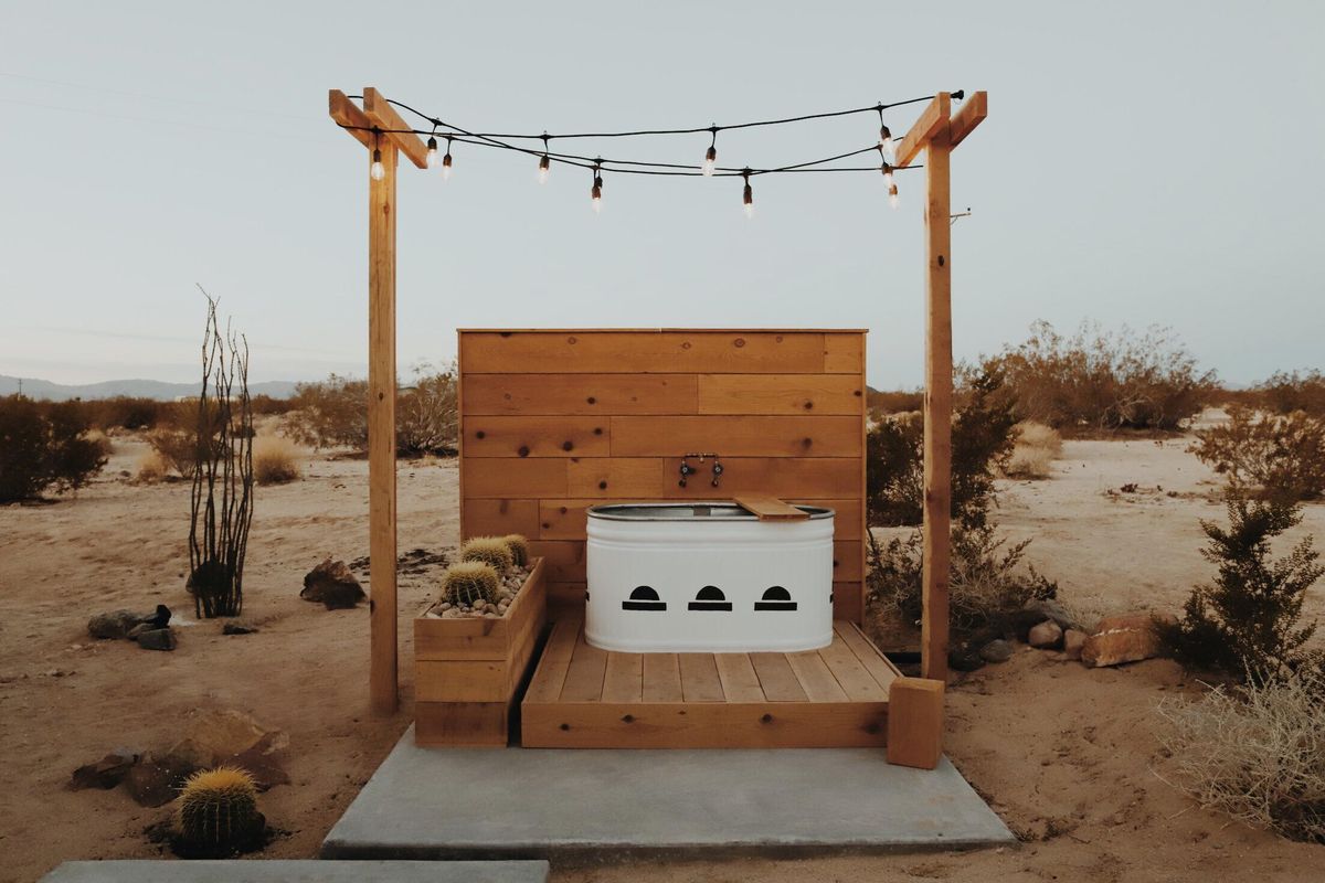Kathrin and Brian Smirke created this stock tank soaking tub outside their California Airbnb. It has become a favorite Instagram backdrop for their guests. (We Are In Our Element / We Are In Our Element)