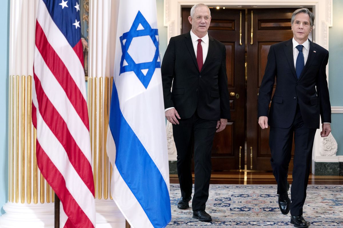 Secretary of State Antony Blinken, right, walks with Israel