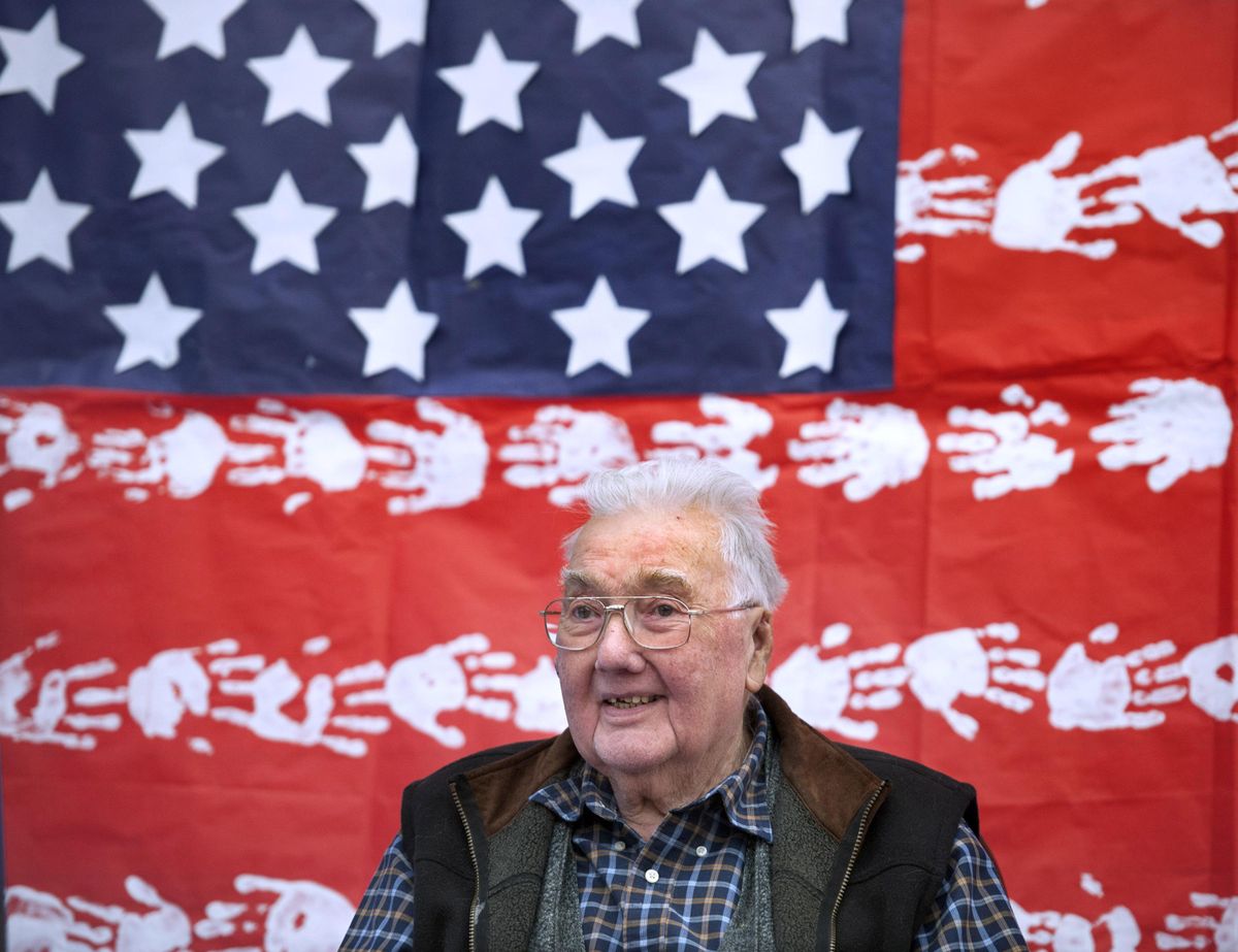 U.S. Navy veteran Herman Huether smiles at the crowd at Mann-Grandstaff VA Medical Center during a celebration on Friday, Dec. 27, 2019. (Kathy Plonka / The Spokesman-Review)