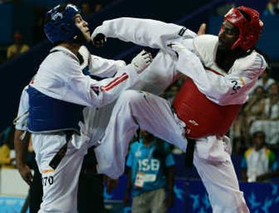 
Brazil's Diogo Silva, right, gets the upper hand against Peru's Peter Lopez during the taekwondo men's 68kg final. Associated Press
 (Associated Press / The Spokesman-Review)