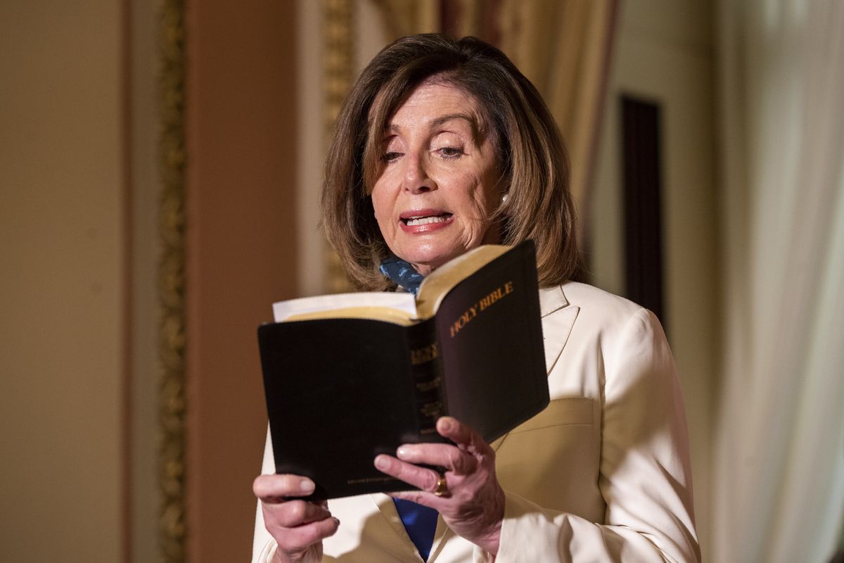 House Speaker Nancy Pelosi of Calif., reads from the Bible, as she reacts to President Donald Trump during a news conference at the U.S. Capitol in Washington, Tuesday, June 2, 2020. (Manuel Balce Ceneta)