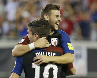 United States' Paul Arriola, right, celebrates with Christian Pulisic. (John Raoux / Associated Press)