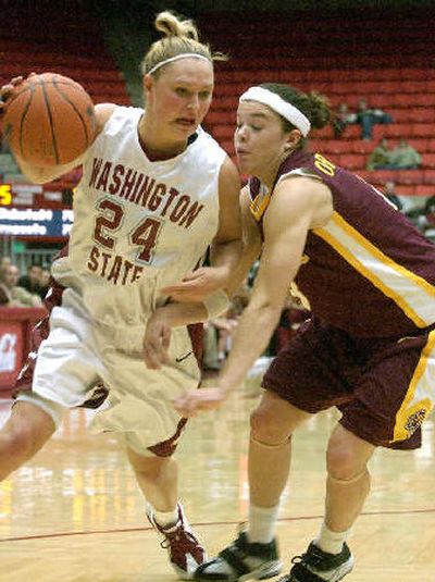 
WSU's Adriane Ferguson from Mead, driving against an Arizona State player Thursday, is helping the Cougars remain positive. 
 (Associated Press / The Spokesman-Review)