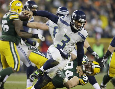 Green Bay Packers’ Dean Lowry sacks Seattle Seahawks quarterback Russell Wilson during the first half  Dec. 11, 2016, in Green Bay, Wisconsin. (Jeffrey Phelps / AP)