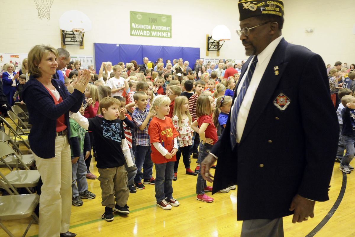 VFW Post 51 member Doug Jones is applauded by Chester Elementary School students and teachers during the school's Veterans Day celebration Wednesday, Nov. 10, 2010. (Dan Pelle / The Spokesman-Review)