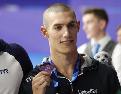 In this file photo dated Thursday, Aug. 9, 2018 bronze medalist Andrea Vergani of Italy poses on the podium of the 50 meters freestyle men final at the European Swimming Championships in Glasgow, Scotland. The Italian swimmer who posted the world’s best time in the men’s 50-meter freestyle this year has been provisionally suspended after testing positive for cannabis. (Darko Bandic / Associated Press)