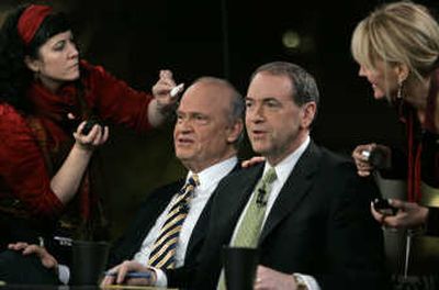 
Fred Thompson, left, and Mike Huckabee have their makeup touched up Sunday at the Fox News  debate in Manchester.
 (The Spokesman-Review)