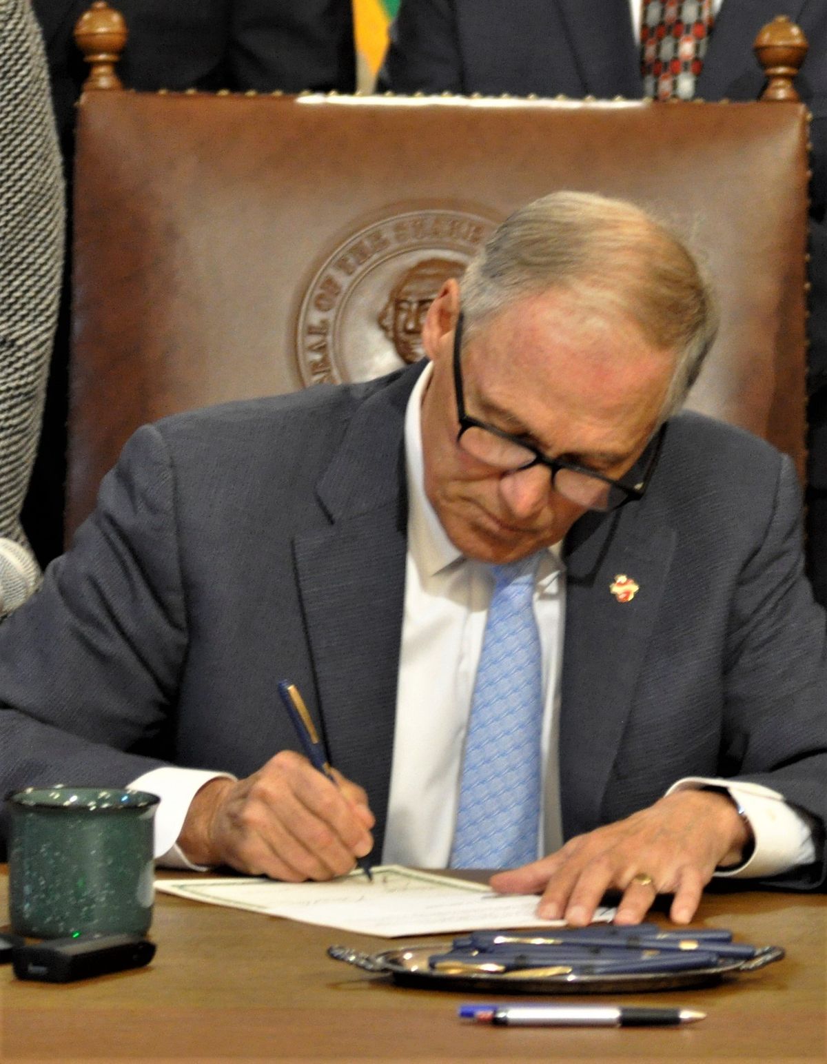 Gov. Jay Inslee signs House Bill 1030, which gives Eastern Washington University and the state’s other regional universities more authority to offer applied doctorate degrees.  (By Jim Camden / For The Spokesman-Review)