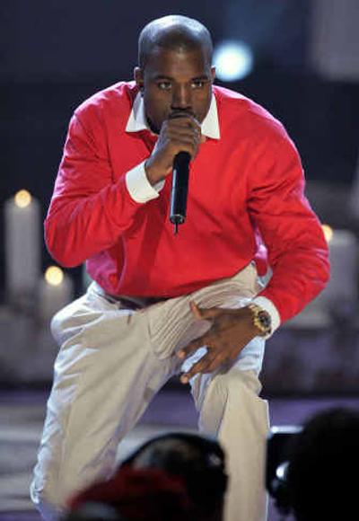 
Rapper Kanye West leads the way at tonight's 47th annual Grammy Awards with 10 nominations. 
 (Associated Press photos / The Spokesman-Review)