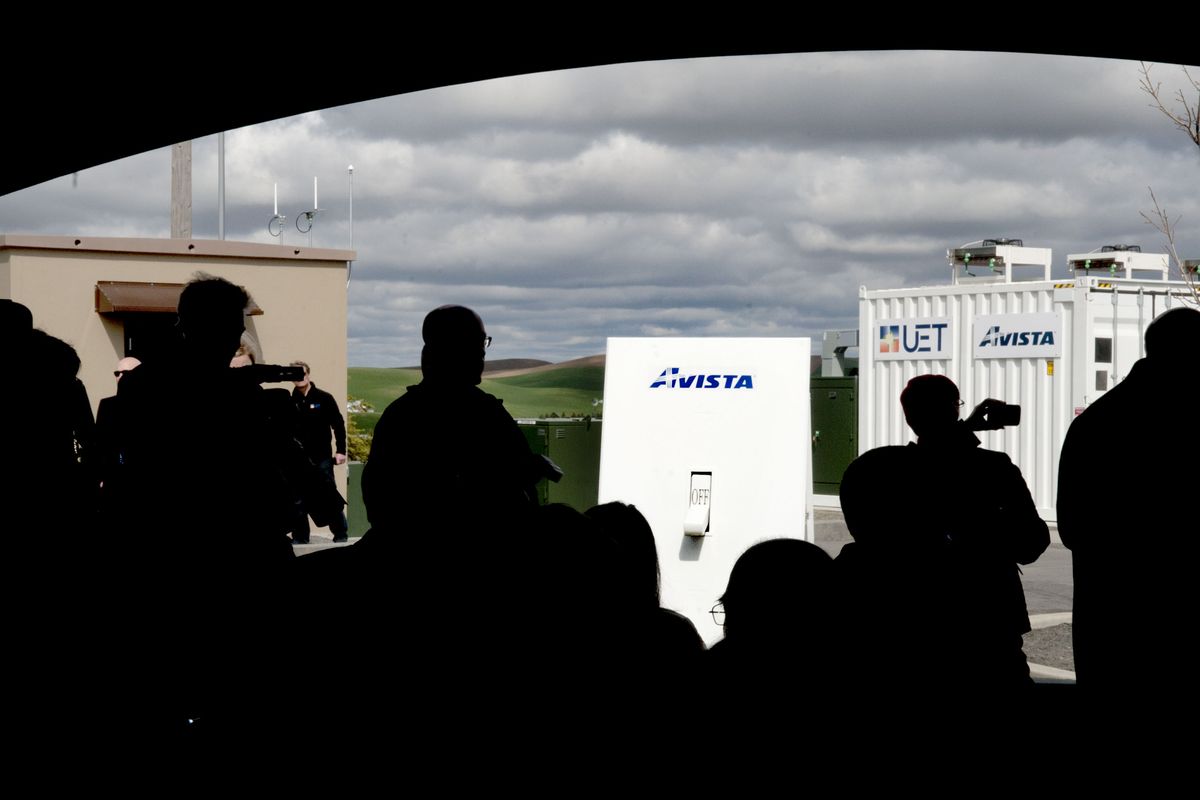 A ceremonial Avista light switch, measuring 6 feet tall, is placed in front of the crowd at Schweitzer Engineering Laboratories in Pullman. (Kathy Plonka)