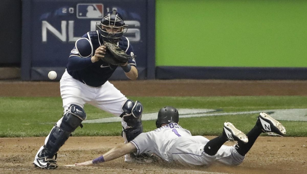 Mike Moustakas scores Christian Yelich in 10th, Brewers top Rockies in NLDS  opener